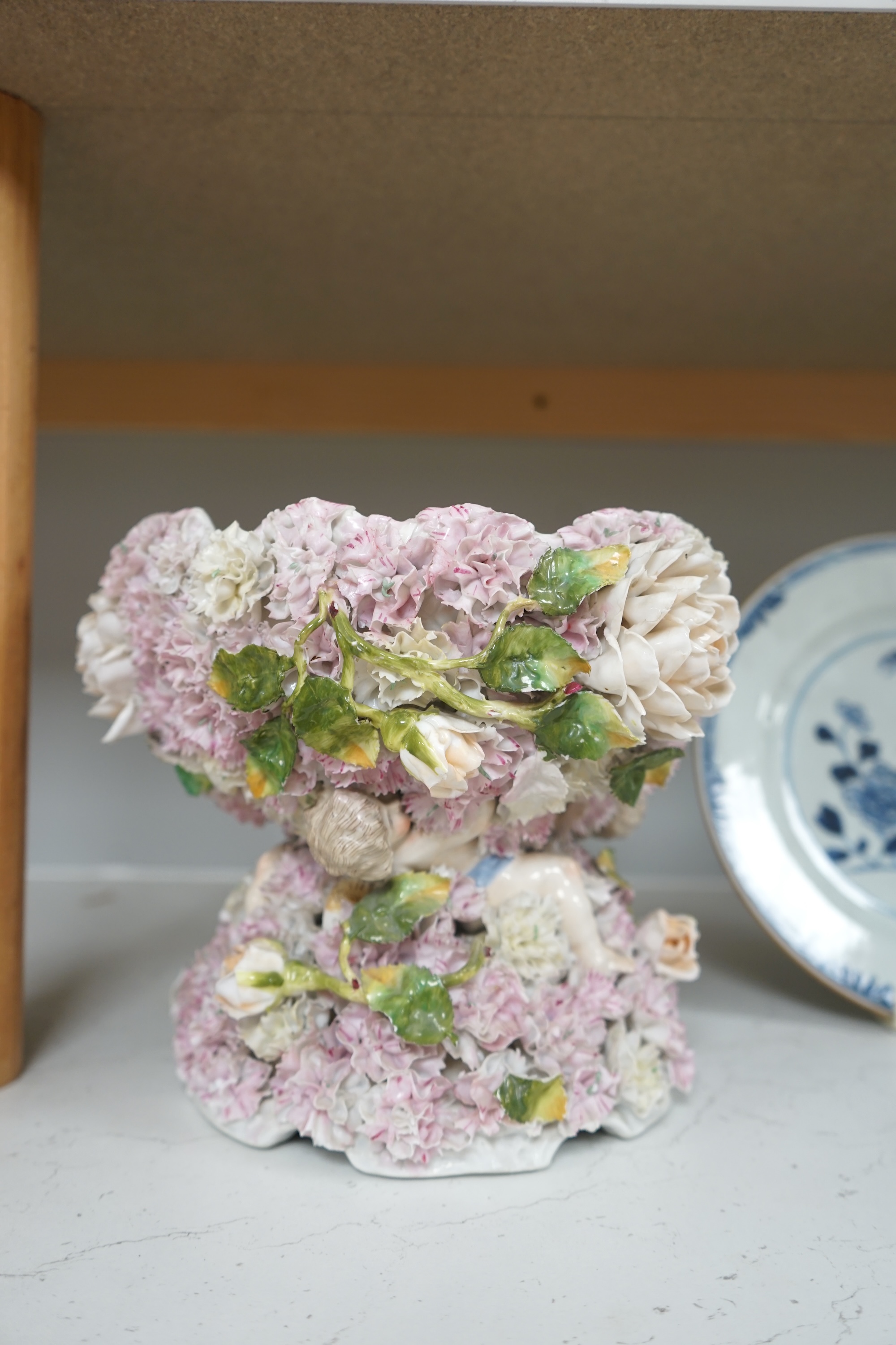 A Sitzendorf figural and flower encrusted jardiniere, 24cm in diameter. Condition - fair to good, minor losses